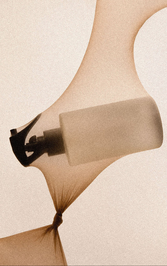 Close-up of a sandal with a beige sandal pad on a beige background